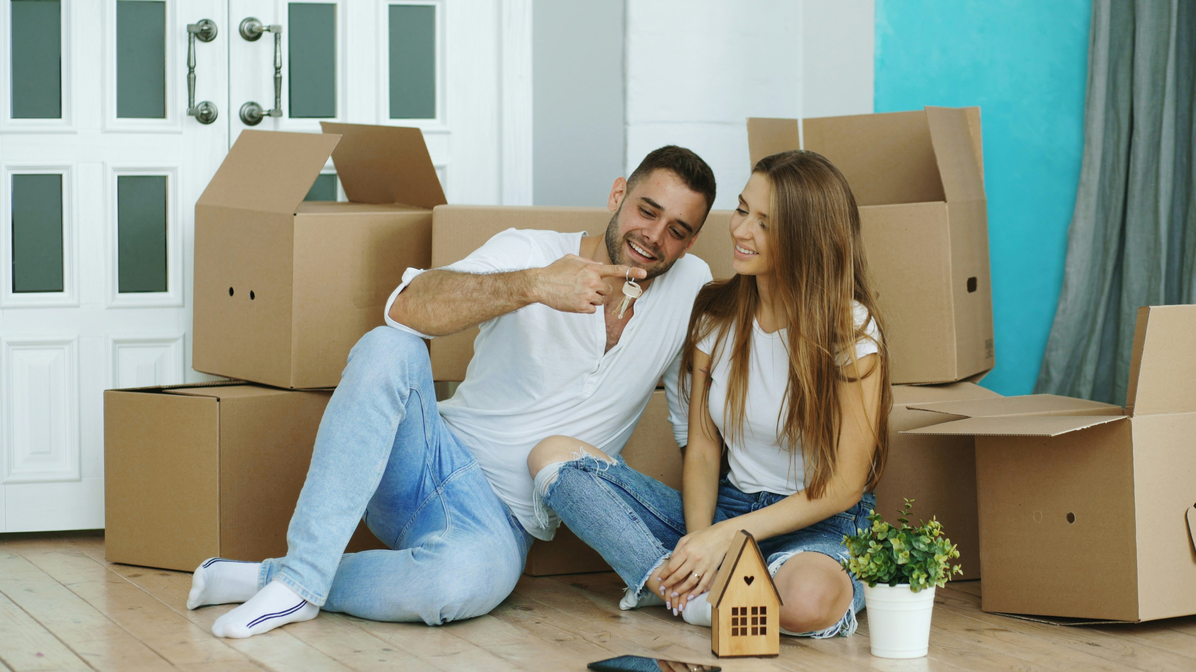 Investors holding house keys after completing a below market value property purchase