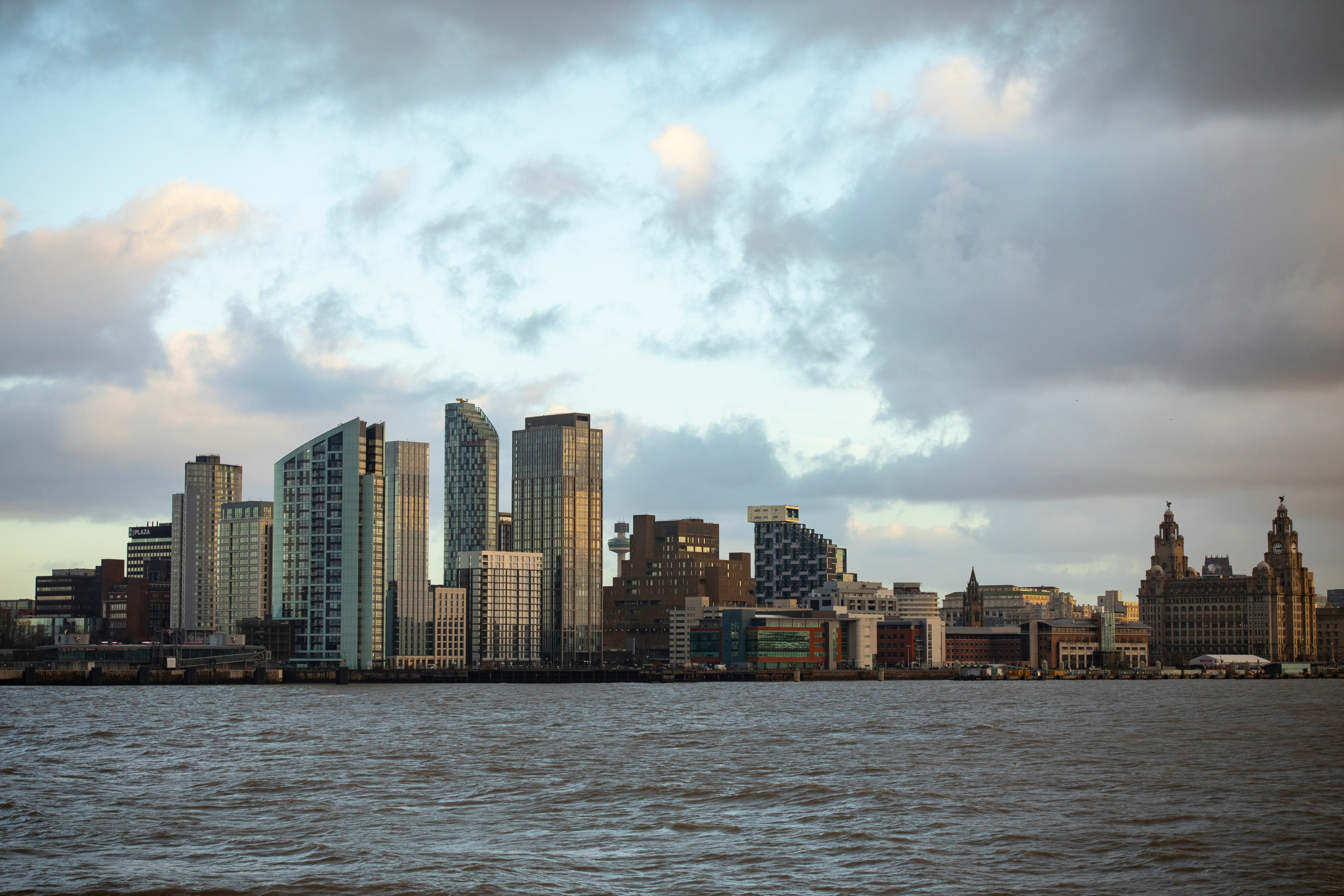 Liverpool waterfront at dusk showing the Three Graces and the Mersey, a key landmark for property investment in Merseyside