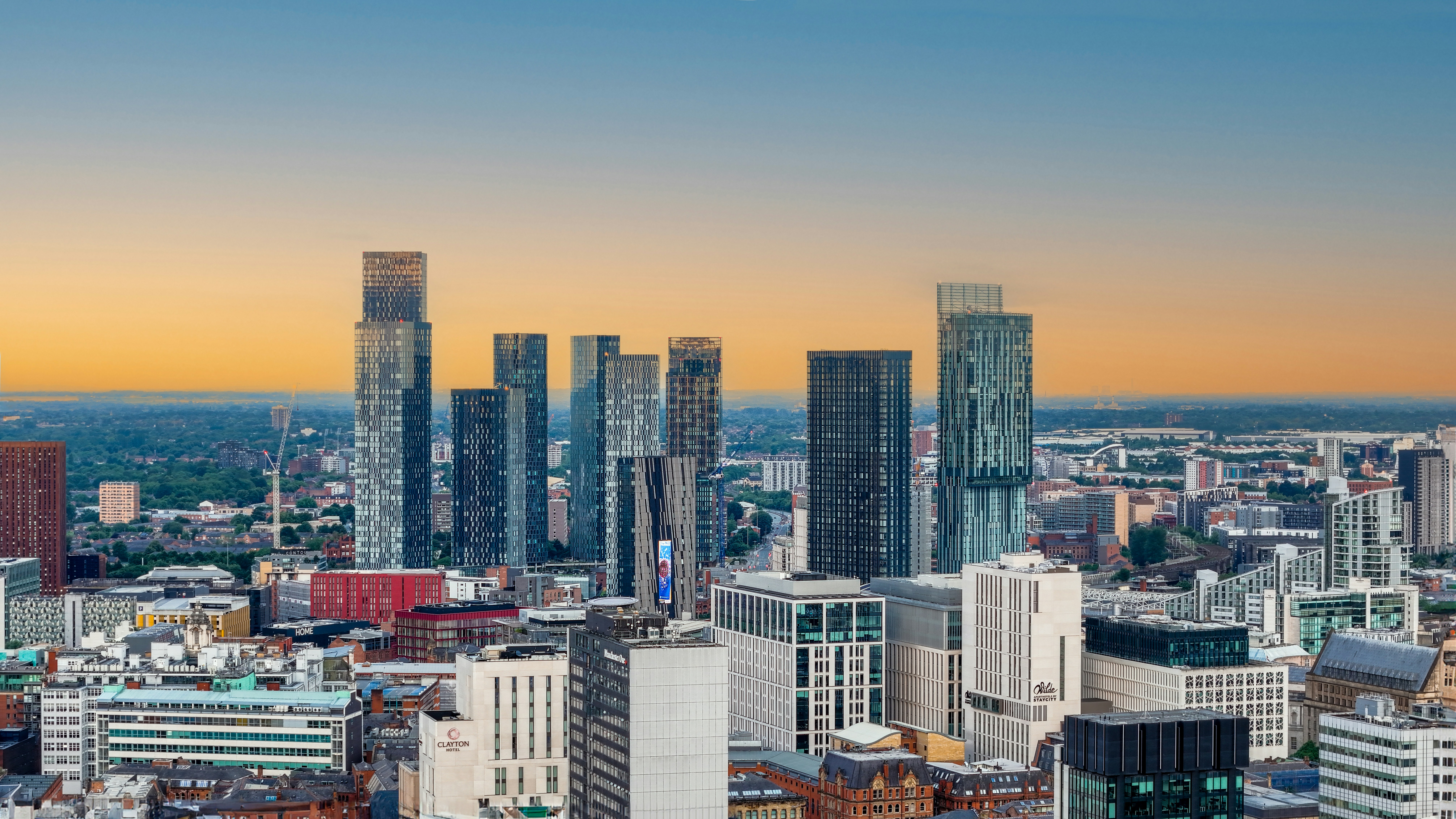 Manchester city skyline at dusk showing the Deansgate Square towers and the Beetham Tower, key landmarks in the Manchester property investment market